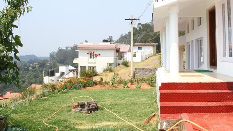 Lawn with hill view and garden