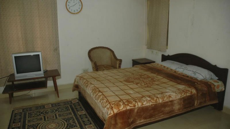 Spacious double bedroom with TV