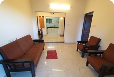 Living room with sofa and armchairs, marble floor and dining area