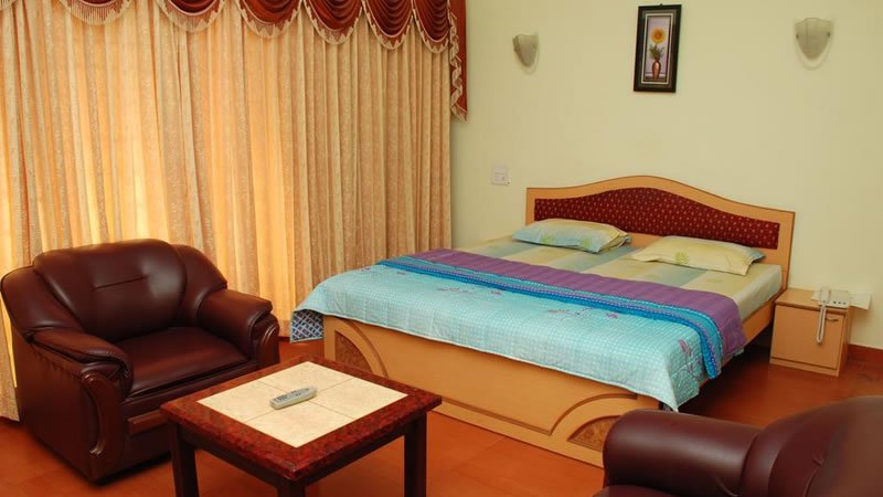 Deluxe bedroom with sofa