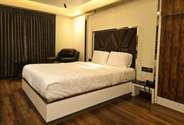 Modern luxury hotel room with wooden flooring