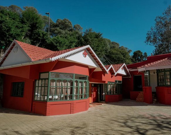 Charming red-roofed cottage stay in Ooty with colonial-style architecture