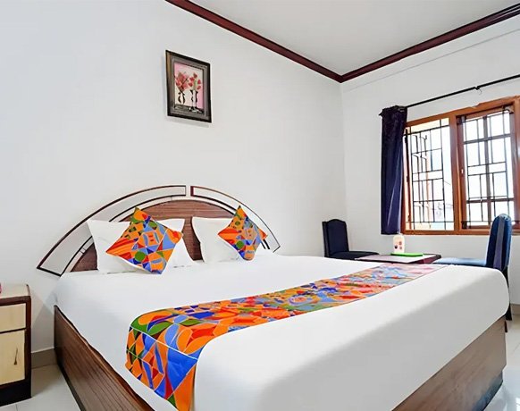Colorful and vibrant double bedroom with modern decor in Ooty hotel
