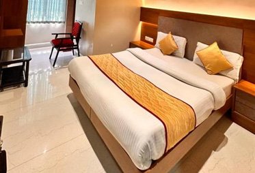Premium hotel room with yellow accents and modern design