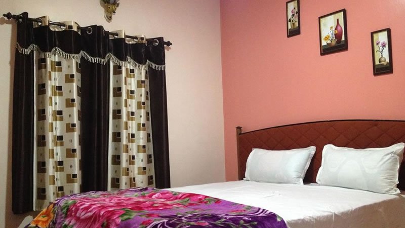 Double bedroom with curtains