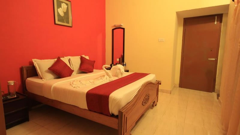 Deluxe bedroom with wooden bed