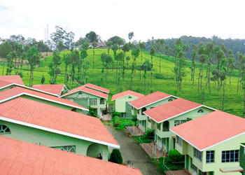 Resort with red roofs amid green hills