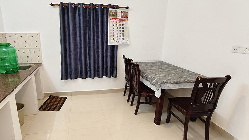 Dining table near small kitchen counter