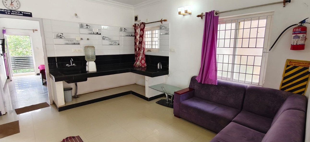 Living room with sofa and kitchenette