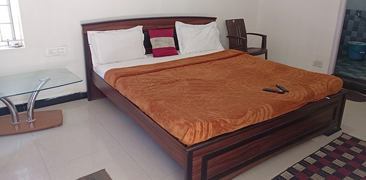 Spacious room with wooden bed