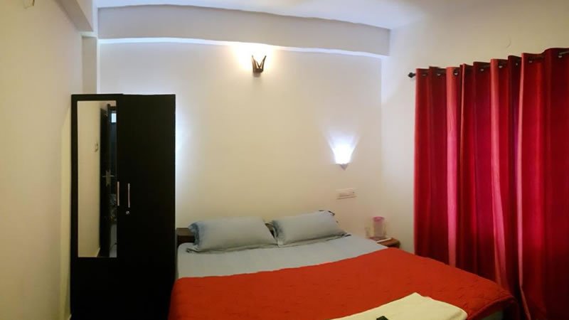 Cozy bedroom with red curtains