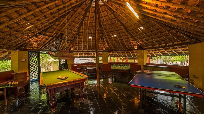 Indoor games room with pool table, table tennis and traditional tiled roof