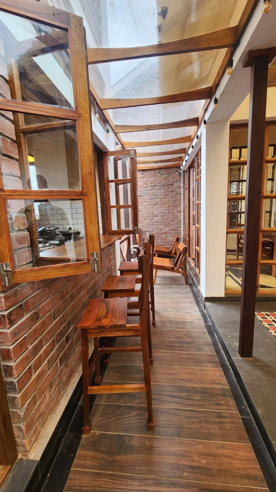 Wooden bar chairs by kitchen